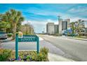 Ocean Dunes Resort & Villas sign welcomes you to Tower 1 with manicured flowerbeds at 210 75Th Ave. N # 4034, Myrtle Beach, SC 29572