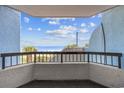 Balcony view overlooking the beach with blue skies and a relaxing outdoor space at 2401 S Ocean Blvd. # 259, Myrtle Beach, SC 29577