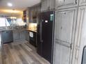 Kitchen features stainless appliances, ample counter space and luxury vinyl flooring at 305 N Hillside Dr. N # 103, North Myrtle Beach, SC 29582