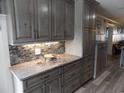 Kitchen with granite countertops and updated cabinetry at 305 N Hillside Dr. N # 103, North Myrtle Beach, SC 29582