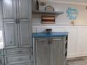 Kitchenette with custom cabinets and ample storage at 305 N Hillside Dr. N # 103, North Myrtle Beach, SC 29582