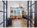 Cozy office space featuring wood floors, a window view, and a stylish wine storage and display area at 318 Board Landing Circle, Conway, SC 29526