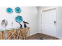 Inviting entryway with decorative wall art, stylish console table, and a well-lit interior at 5152 Yellowstone Dr., Conway, SC 29526