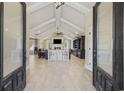 Spacious living room with vaulted ceilings, a large fireplace, and an open floor plan at 5825 Peachtree Rd., Myrtle Beach, SC 29588