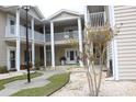 Attractive condominium with multiple balconies, manicured landscaping and sidewalks at 6204 Sweetwater Blvd. # 6204, Murrells Inlet, SC 29576