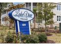 Lake View Villas sign with beautiful landscaping and building in background at 627 Bonaventure Dr. # 101, Myrtle Beach, SC 29577