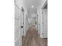 Hallway featuring wood floors, neutral walls and trim with entryways at 627 Bonaventure Dr. # 103, Myrtle Beach, SC 29577