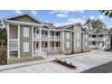 Multi-Gathering home featuring neutral siding, covered balconies, white railings, and newly installed landscaping at 627 Bonaventure Dr. # 203, Myrtle Beach, SC 29577
