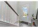 Bright entryway featuring luxury vinyl plank flooring, a glass door, and a stylish welcome mat at 809 Belle Dr., North Myrtle Beach, SC 29582