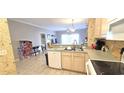Well-lit kitchen area connects to living space, with modern appliances and a practical layout at 1100 Commons Blvd. # 606, Myrtle Beach, SC 29572