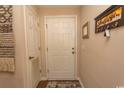 Hallway featuring a white door, decorative accents and neutral wall color at 1221 Tidewater Dr. # 1922, North Myrtle Beach, SC 29582
