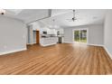 Open concept living room with hardwood floors leading into the kitchen area with recessed lighting at 1274 Pinetucky Dr., Galivants Ferry, SC 29544