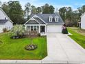 Inviting single-story home boasting well-maintained landscaping and a convenient two-car garage at 129 Astoria Park Loop, Conway, SC 29526