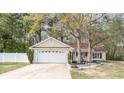 Inviting one-story home with a two-car garage and landscaped front yard at 550 Crusade Circle, Conway, SC 29526