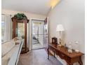 Inviting entryway with decorative table, glass cabinet, and view of the well-maintained exterior at 550 Crusade Circle, Conway, SC 29526