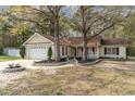 Inviting single-story home with a well-manicured lawn, charming landscaping, and a welcoming walkway at 550 Crusade Circle, Conway, SC 29526