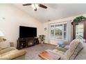 Comfortable living room with plush seating, a fireplace, and a large window at 550 Crusade Circle, Conway, SC 29526