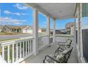 Cozy front porch with seating, perfect for relaxing and enjoying the neighborhood view at 852 Harrison Mill St., Myrtle Beach, SC 29579