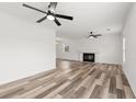 Spacious living room featuring modern floors, a fireplace, recessed lighting, and ceiling fans at 1287 Stalvey Ave., Myrtle Beach, SC 29577