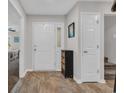 Entryway with wood-look floors, a small accent table, and neutral paint at 1421 Cottesmore Ct., North Myrtle Beach, SC 29582