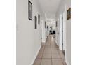 Hallway has tile flooring and leads to the living room with neutral decor at 1525 Lanterns Rest Rd. # 304, Myrtle Beach, SC 29579