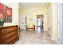 Inviting foyer featuring tiled flooring, wall decor, and a bench for seating at 1965 24Th Ave. N, North Myrtle Beach, SC 29582