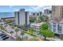 Stunning aerial view showcases this condo's prime location near beaches and attractions, enhanced by lush landscaping and ample parking at 211 76Th Ave. N # A-2, Myrtle Beach, SC 29572