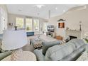 Bright living room with vaulted ceilings, neutral colors, cozy seating, and large windows at 3148 Bayhaven Dr., Myrtle Beach, SC 29579