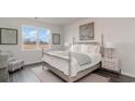 Comfortable bedroom showcasing a large window, four-post bed, and neutral decor at 315 Glade Ct., Loris, SC 29569