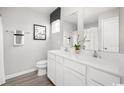 Bright bathroom featuring a double sink vanity with white cabinets and modern fixtures at 319 Myrtle Meadows Dr # 401D, Conway, SC 29526