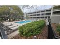 Inviting community pool area with lounge chairs and lush landscaping at 415 Ocean Creek Dr. # 2443, Myrtle Beach, SC 29572