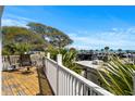 Relaxing balcony seating area with views of the trees, RV park, and ocean at 6001- L08 S Kings Hwy., Myrtle Beach, SC 29575