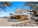Bright, stilted home with a large balcony overlooking a serene community and the ocean at 6001- L08 S Kings Hwy., Myrtle Beach, SC 29575