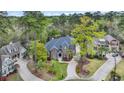 Lovely brick home nestled in a wooded cul-de-sac with manicured lawns at 653 Whispering Pines Ct., Murrells Inlet, SC 29576