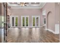 Spacious living room featuring tile floors, high ceilings and multiple doors to the back patio at 653 Whispering Pines Ct., Murrells Inlet, SC 29576