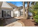 Inviting front entrance with a brick walkway and manicured landscaping, leading to a well-maintained home at 808 Arbor Ln., North Myrtle Beach, SC 29582