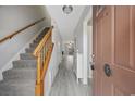 Inviting entryway with staircase, gray floors, coat closet, and neutral paint at 830 44Th Ave. N # X-2, Myrtle Beach, SC 29577