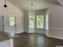 Dining room area featuring many windows providing natural light and wood floors at 1397 Knotty Branch Rd., Conway, SC 29527