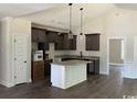 Open kitchen features grey cabinets, white marbled countertops, and stainless steel sink at 1397 Knotty Branch Rd., Conway, SC 29527