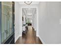 Long hallway with hardwood floors, decorative lighting, and neutral paint at 1478 Suncrest Dr., Myrtle Beach, SC 29577