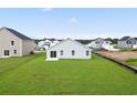 Expansive backyard featuring a lush green lawn and freshly constructed home at 33 Cape Point Dr., Conway, SC 29527
