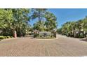 Wide brick-paved entranceway into Ocean Keyes with landscaped median at 601 Hillside Dr. N # 2305, North Myrtle Beach, SC 29582