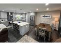 Modern kitchen with a central island, stainless steel appliances, and sleek countertops at 710 62Nd Ave. N, Myrtle Beach, SC 29572