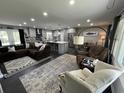 Open-concept living room and kitchen with modern design and plenty of natural light at 710 62Nd Ave. N, Myrtle Beach, SC 29572