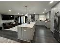 Open concept living space with modern kitchen with a large center island and stainless steel appliances at 710 62Nd Ave. N, Myrtle Beach, SC 29572