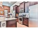 This gourmet kitchen features stainless steel appliances, granite countertops and custom cabinetry at 72 Landing Rd. # 0, Pawleys Island, SC 29585
