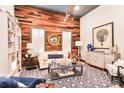 Inviting living room featuring a decorative wood wall, contemporary furnishings and stylish accents at 72 Landing Rd. # 0, Pawleys Island, SC 29585