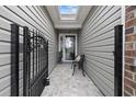 Inviting front porch with decorative iron gate and stylish seating, creating an elegant entrance at 90 Carolina Crossing Blvd., Little River, SC 29566