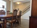 Warm dining area features a traditional wooden table and chairs, with staircase access visible at 1101 Bronwyn Circle, North Myrtle Beach, SC 29582
