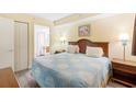 Bright bedroom featuring a queen-sized bed, decorative artwork, and a closet at 1604 N Ocean Blvd. # 903, Myrtle Beach, SC 29577